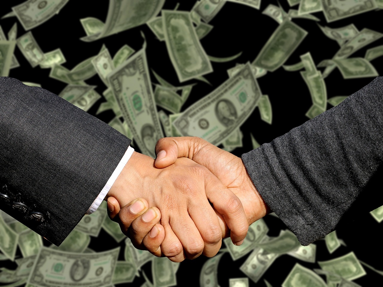 Handshake, agreement, trade — Collaborate with a Prop Trading Firm to Grow Your Portfolio
