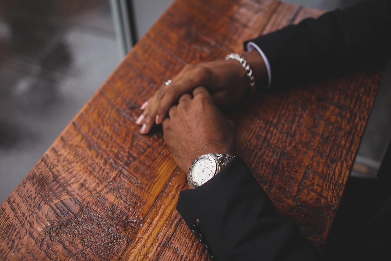 Business, hands, wristwatch — Reasons You Should Hire a Foreclosure Attorney