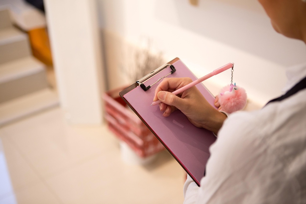 Writing, beautiful flowers, pencil — Simplify Project Management for Residential Builds with Tailored Software Solutions