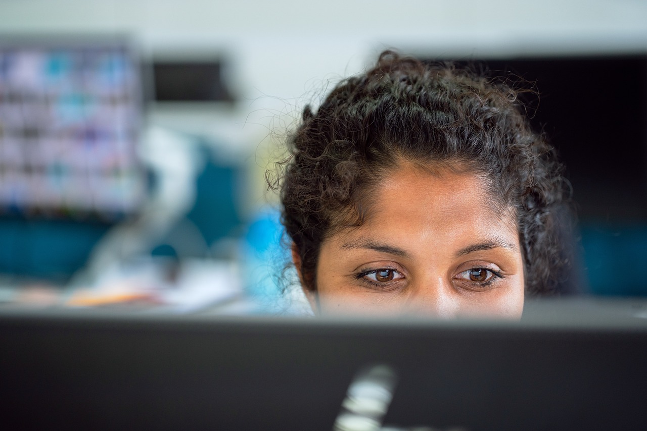 Woman, work, office — Stay Competitive in the Market by Adding White Label SEO to Your Portfolio