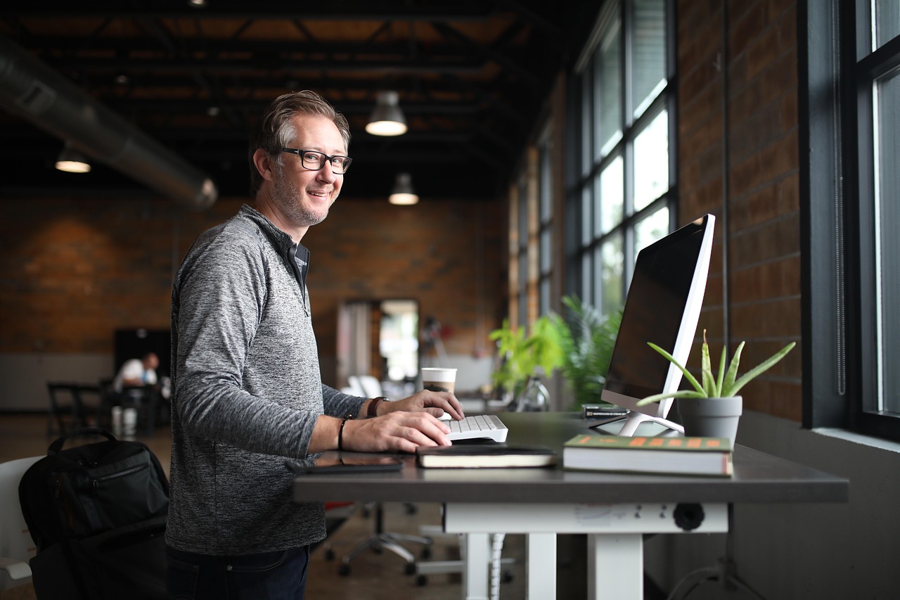 Office desk, man, business — The Importance of Proper Loft Ladders Installation