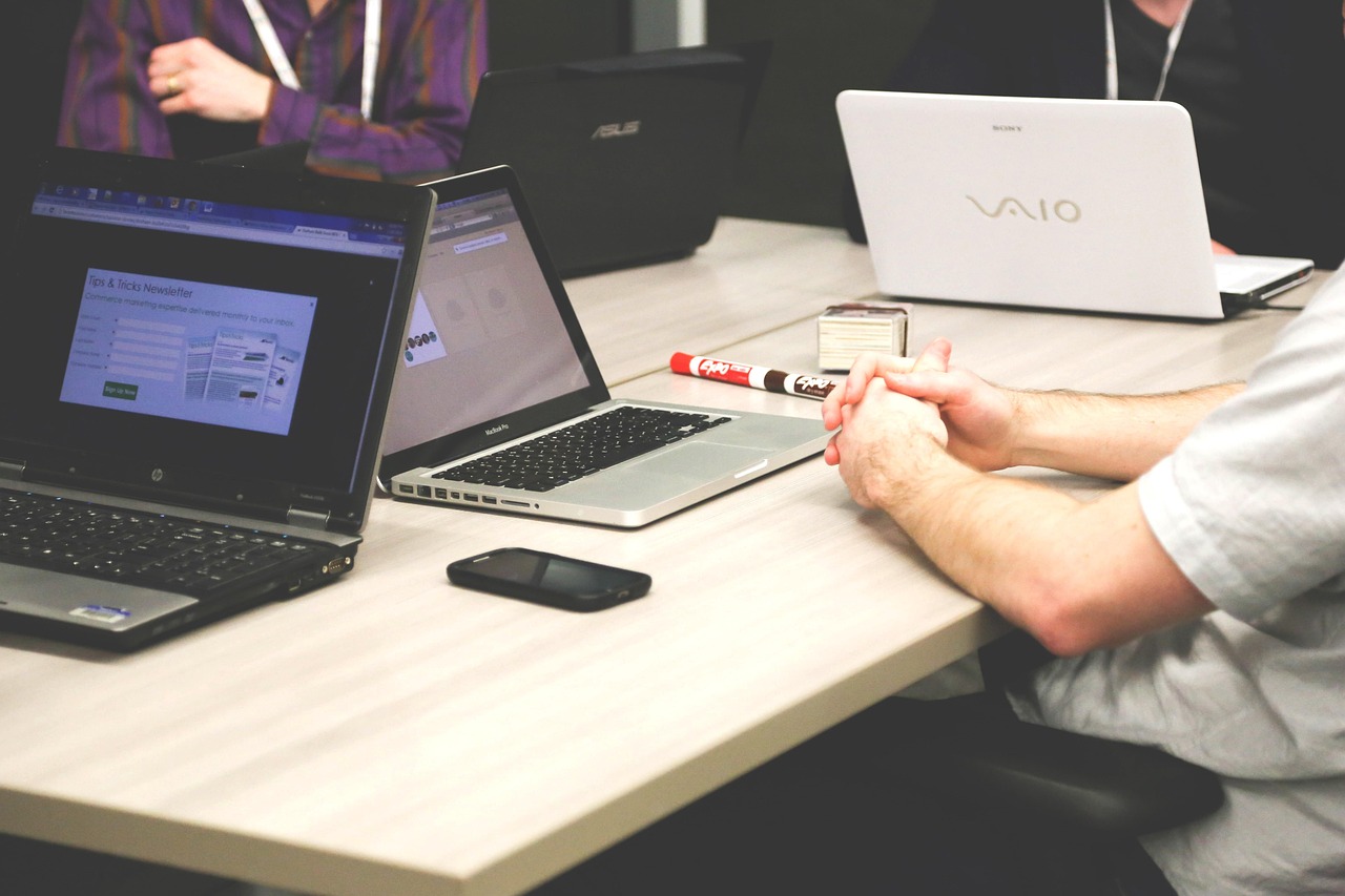 Laptops, meeting, businessmen — What to Gift Your Corporate Clients This Holiday Season
